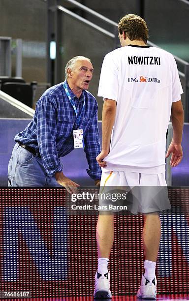 Holger Geschwindner speaks with Dirk Nowitzki of Germany during the halftime break during the FIBA EuroBasket 2007 qualifying round Group F match...