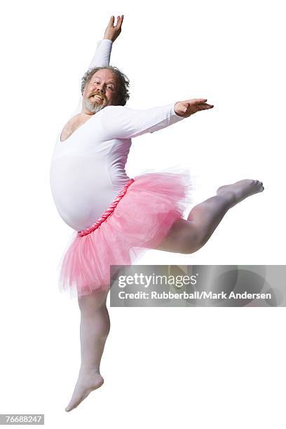 overweight man in ballerina tutu smiling and dancing - tutú fotografías e imágenes de stock