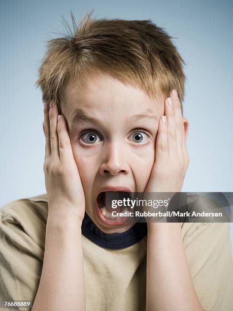 boy with hands on face and mouth open surprised - open day 6 fotografías e imágenes de stock