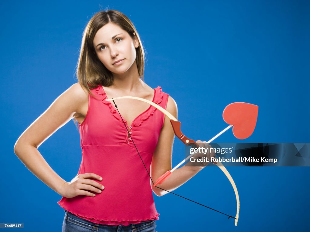 Woman with bow and arrow with heart
