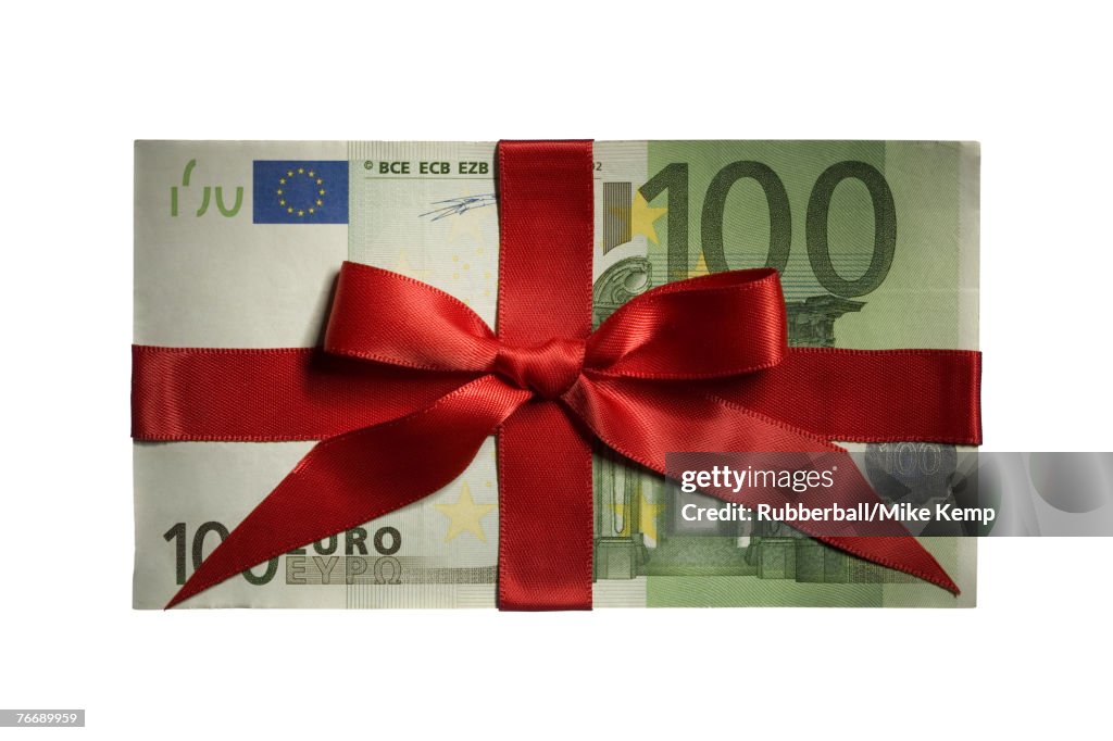 One hundred Euro banknote with red ribbon