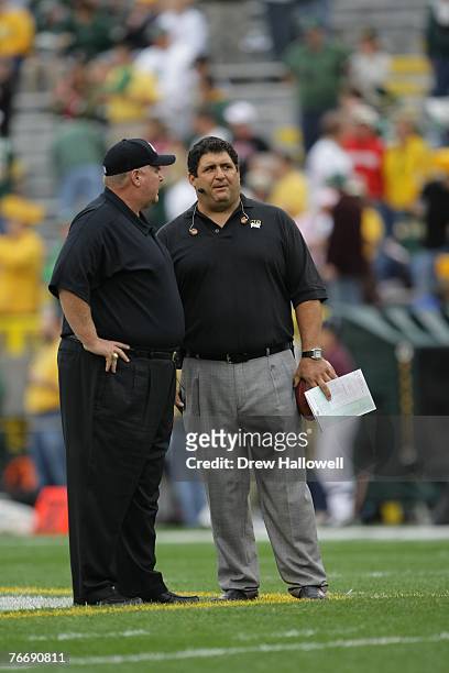 Coach Andy Reid of the Philadelphia Eagles talks with reporter Tony Siragusa before the game against the Green Bay Packers on September 9, 2007 at...