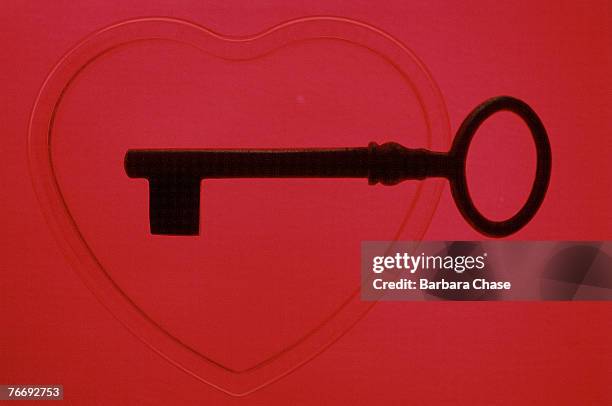 silhouette of key above heart - barbara valentin stock pictures, royalty-free photos & images