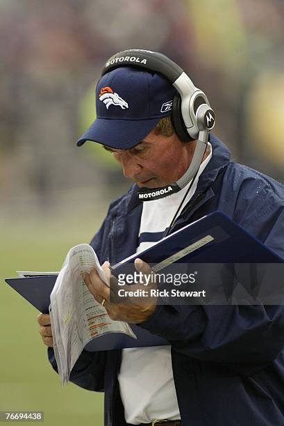 Head coach Mike Shanahan of the Denver Broncos looks at the playbook during the game against the Buffalo Bills on September 9, 2007 at Ralph Wilson...