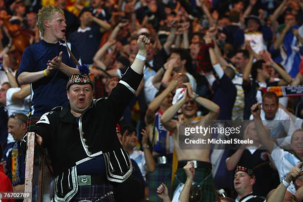 Scotland fans celebrate after their team's 1-0 victory after the Euro 2008 Group B qualifying match between France and Scotland at the Parc de...