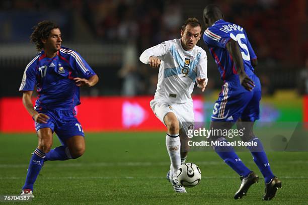 James McFadden of Scotland takes on Lilian Thuram and Julien Escude during the Euro 2008 Group B qualifying match between France and Scotland at the...