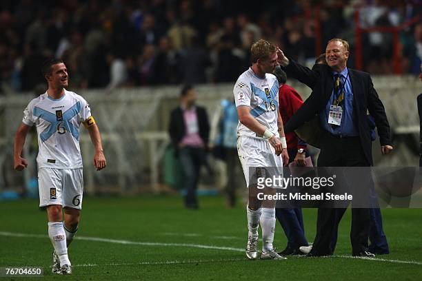 Scotland manager Alex McLeish celebrates his side's 1-0 victory at the final whistle with Garry O'Connor and captain Barry Ferguson during the Euro...