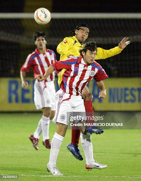 Colombia's Radamel Falcao Garcia goes for a header with Paraguay's Edgar Barreto during a friendly match 12 September in Bogota, Colombia. Colombia...