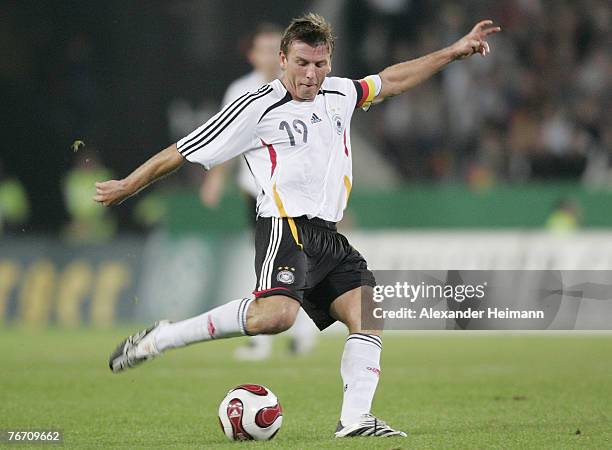 Bernd Schneider of Germany competes with of Romania during the international friendly match between Germany and Romania at the Rheinenergie stadium...