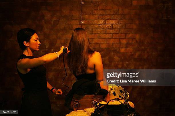 Contestant has her hair done backstage during the Miss Earth Australia contest at the Enmore Theatre, September 13, 2007 in Sydney, Australia....