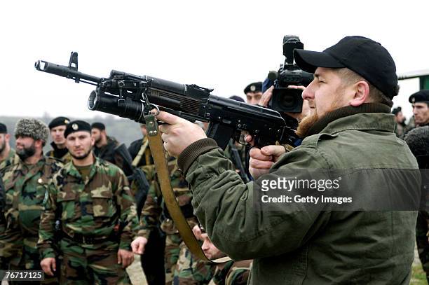 Ramzan Kadyrov proudly displays his shooting skills at a firing range in his village of Tsentoroi in front of members of his private army. Officially...