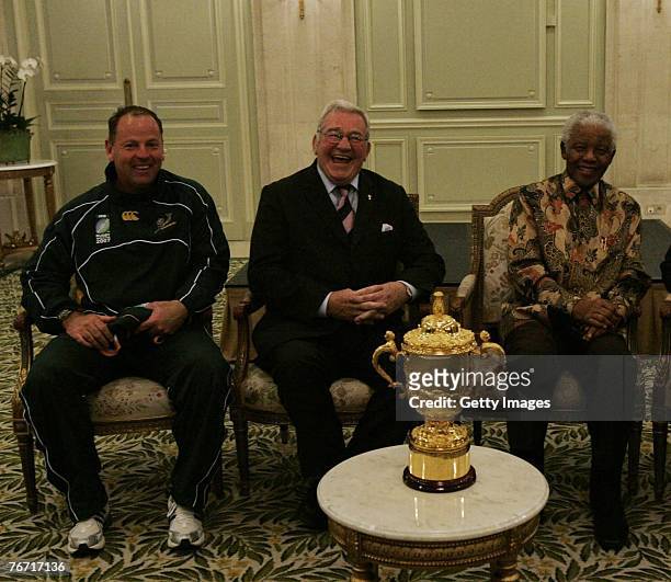 Jake White, Dr Syd Millar and Mr Nelson Mandela sit with the Webb Ellis Cup during the Springboks press conference at their hotel September 13, 2007...
