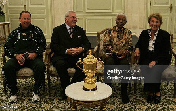 Jake White, Dr Syd Millar , Mr Nelson Mandela and Mrs Enid Millar sit with the Webb Ellis Cup during the Springboks press conference at their hotel...