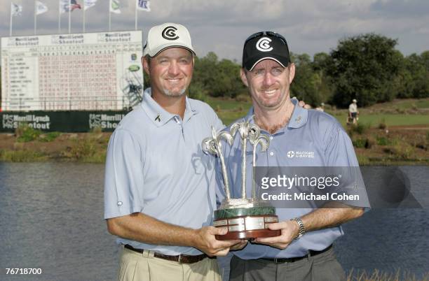 Rod Pampling and Jerry Kelly with the trophy after the third and final round of the Merrill Lynch Shootout at the Tiburon Golf Club in Naples,...