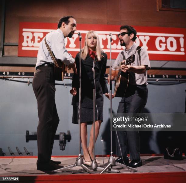 Noel "Paul" Stookey, Mary Travers, and Peter Yarrow of Peter Paul and Mary perform "Tell It to the Mountain" on British television show "Ready,...