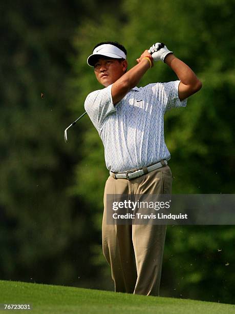 Choi of South Korea watches his approach shot on the 17th hole during the second round of The Barclays, the inaugural event of the new PGA TOUR...