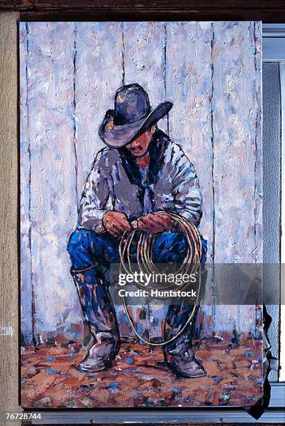 cowboy sitting down - vaqueros stock pictures, royalty-free photos & images