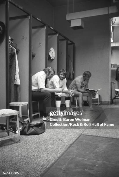 Oakland Raiders head coach John Madden and Raiders quarterback, Ken Stabler, in a locker room, 1975.