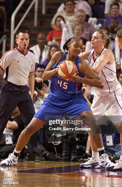 Penny Taylor of the Phoenix Mercury guards Kara Braxton of the Detroit Shock during Game Four of the WNBA Finals at U.S. Airways Center on September...