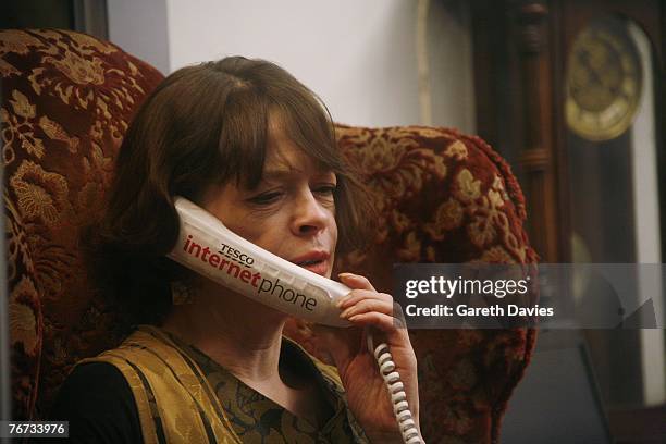 Jenny Barnard, a fashion designer from North London, talks on the phone as she tries to break the World Record for the longest phone call at Tesco's...