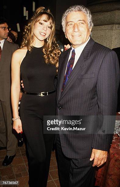 American R&B and Pop singer Mariah Carey and Jazz and Pop singer Tony Bennett pose together during a benefit concert at the Cathedral of St John the...