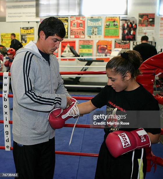 Susi Kentikian of Germany and her trainer Mago poses during the photocall on May 8, 2007 in Hamburg, Germany.