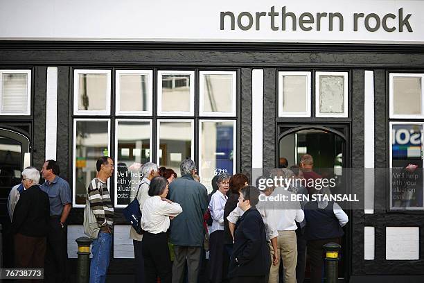 Customers queue to enter a Northern Rock branch in Bromley, in south-east London, 14 September 2007. The Bank of England has stepped in to provide...