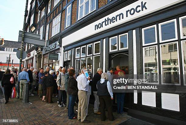 Customers queue to enter a Northern Rock branch in Bromley, in south-east London, 14 September 2007. The Bank of England has stepped in to provide...