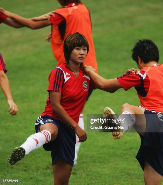 Han Duan and Ma Xiaoxu of China warm-up during a training session for the Women's World Cup 2007 on September 14, 2007 in Wuhan, China.