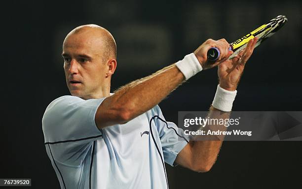 Ivan Ljubicic of Croatia returns a shot against Marcos Baghdatis of Cyprus during the quarter-finals on day five of the China Tennis Open on...