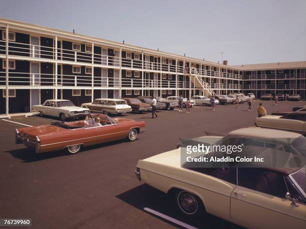 View of the busy parking lot at the Royal Anchor motel, Old Orchard Beach, Maine, 1960s.