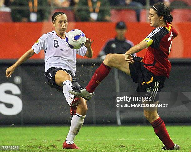 German player Birgit Prinz fights for the ball with England player Fara Williams during the 2007 FIFA Women's World Cup soccer tournament Group A...