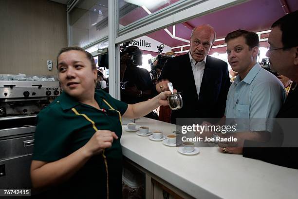 Actor and former U.S. Senator Fred Thompson and Rep. Carlos Lopez-Cantera wait as a waitress prepares a cup of Cuban coffee for them to drink during...