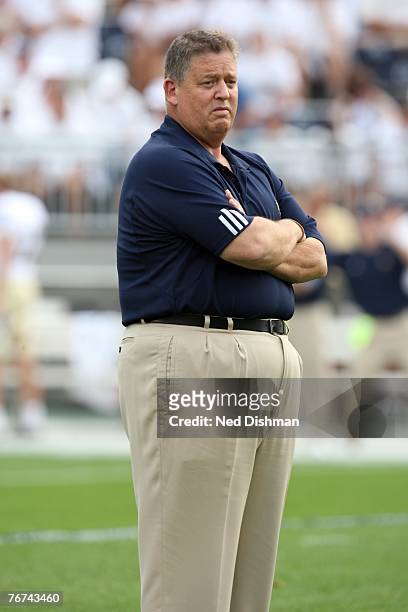 Head coach Charlie Weis of the University of Notre Dame Fighting Irish stands on the field during warmups against the Penn State Nittany Lions at...