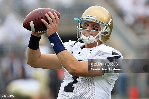 Quarterback Jimmy Clausen of the University of Notre Dame Fighting Irish warms up pregame against the Penn State Nittany Lions at Beaver Stadium on...