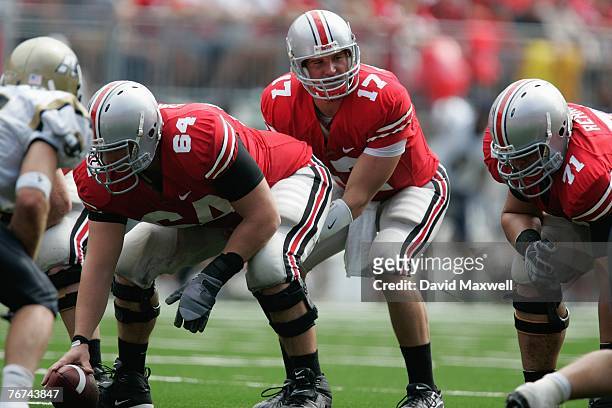 Todd Boeckman of the Ohio State Buckeyes stands under center Jim Cordle during the game against the Akron Zips at Ohio Stadium on September 8, 2007...