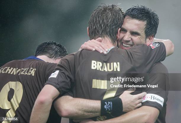 Marvin Braun of St.Pauli celebrates scoring the second goal with Thomas Meggle and Rene Schnitzler during the Second Bundesliga match between FC...