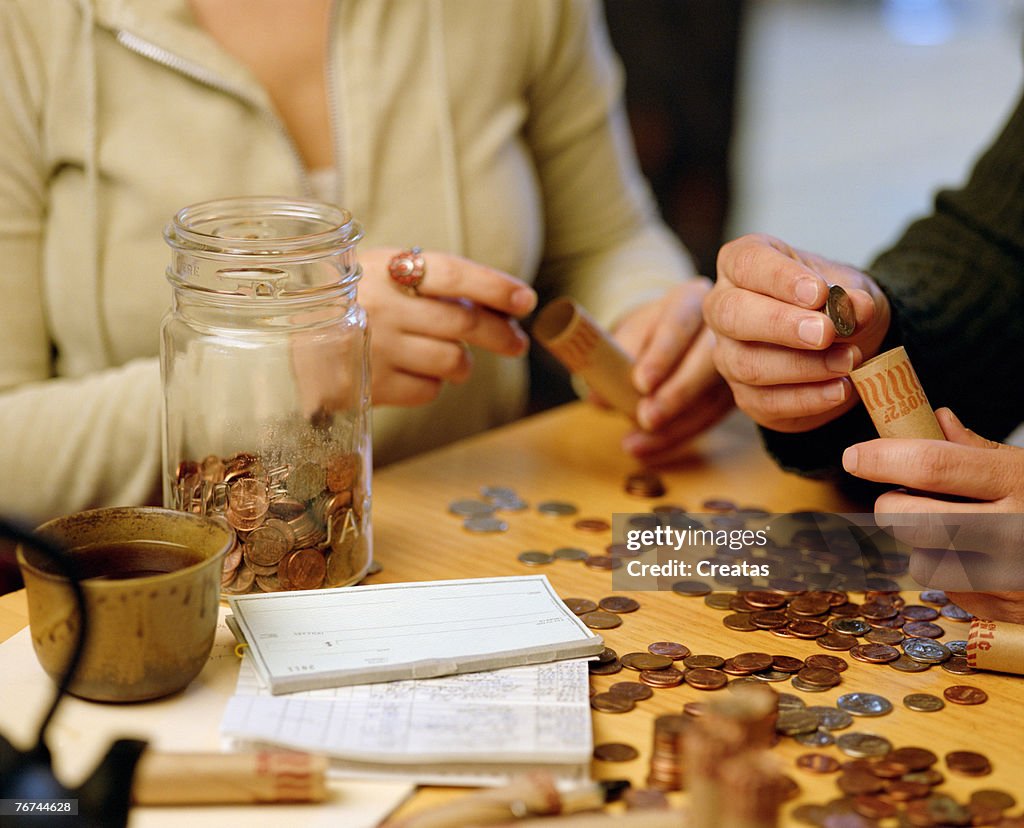 Man and woman sorting coins