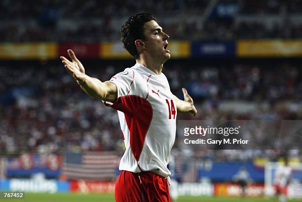 Marcin Zewlakow of Poland celebrates scoring the third goal during the FIFA World Cup Finals 2002 Group D match between Poland and USA played at the...