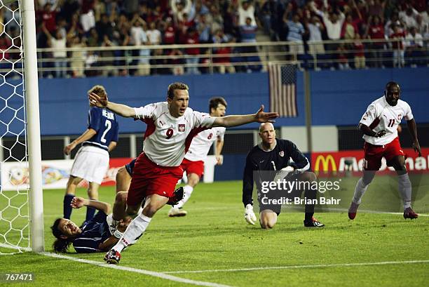 Pawel Kryszalowicz of Poland celebrates scoring the second goal during the FIFA World Cup Finals 2002 Group D match between Poland and USA played at...