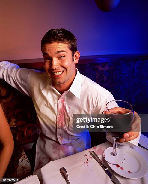 man with wine stain on shirt - wine stain imagens e fotografias de stock