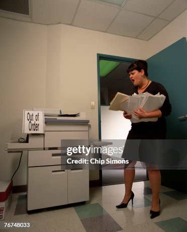 Break Copy Machine Businesswoman With Files And Broken Copy Machine High-Res Stock Photo ...