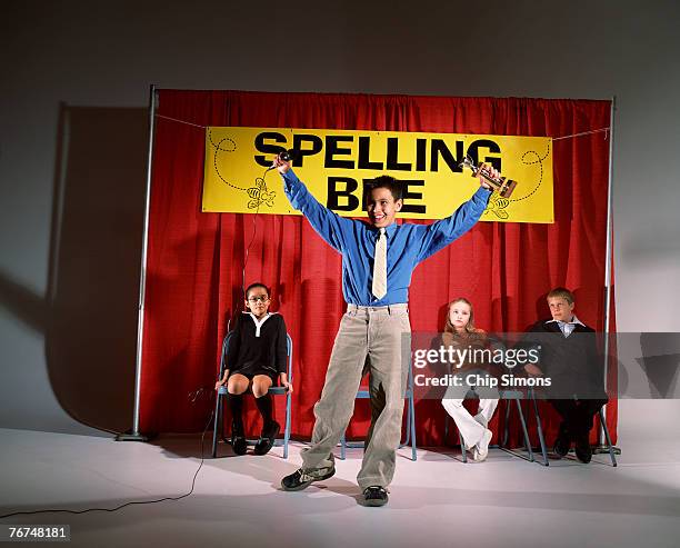 boy winning spelling bee - spelling bee stock pictures, royalty-free photos & images