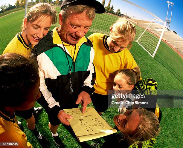 soccer huddle - coach playbook stock pictures, royalty-free photos & images