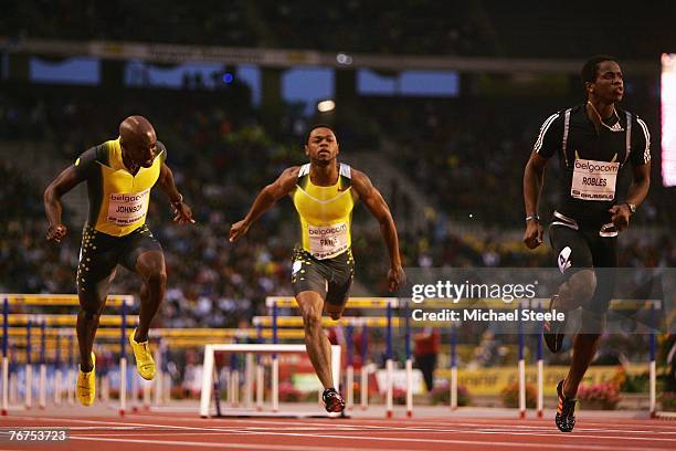 Dayron Robles of Cuba wins the men's 110 m hurdles from David Payne and Allen Johnson, both of USA, during the IAAF Golden League Memorial Van Damme...