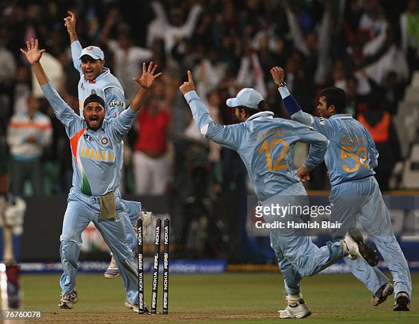 Harhajan Singh, Virender Sehwag, Yuvraj Singh and Sreesanth of India celebrate the run out of Misbah-ul-Haq of Pakistan of the last ball of the...