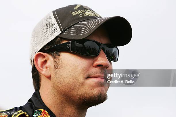 Martin Truex Jr., driver of the Bass Pro Shops/Tracker Boats Chevrolet, watches during qualifying for the NASCAR Nextel Cup Series Sylvania 300 at...