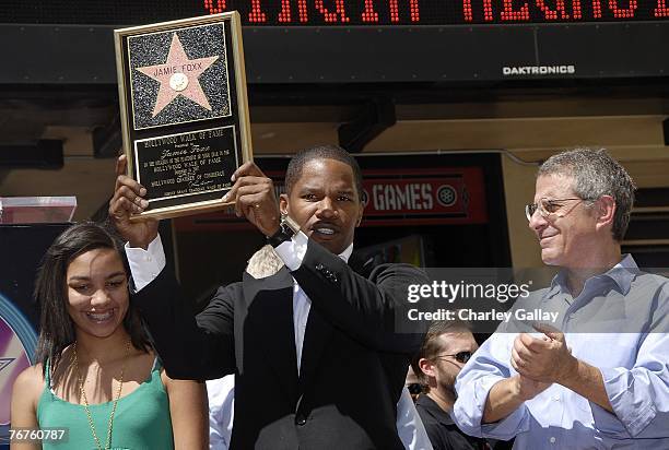 Actor-musician Jamie Foxx , his daughter Connie , and Universal's Ron Meyer attend a ceremony honoring him with a star on the Hollywood Walk of Fame...