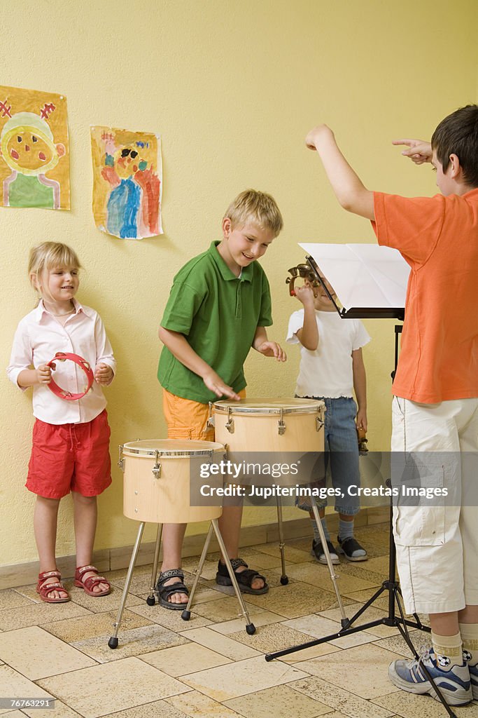 Students Using Instruments Students Playing Percussion Instruments In Class High-Res Stock Photo ...