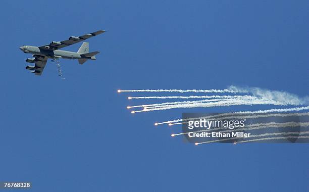 Stratofortress drops 500-pound bombs and flares during a U. S. Air Force firepower demonstration at the Nevada Test and Training Range September 14,...